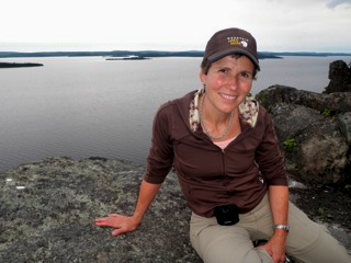 Nicole Guertin owner of the Presidents' Suites on top of Devil's rock / propriétaire des Suites des Présidents à Haileybury en haut du rocher du diable.