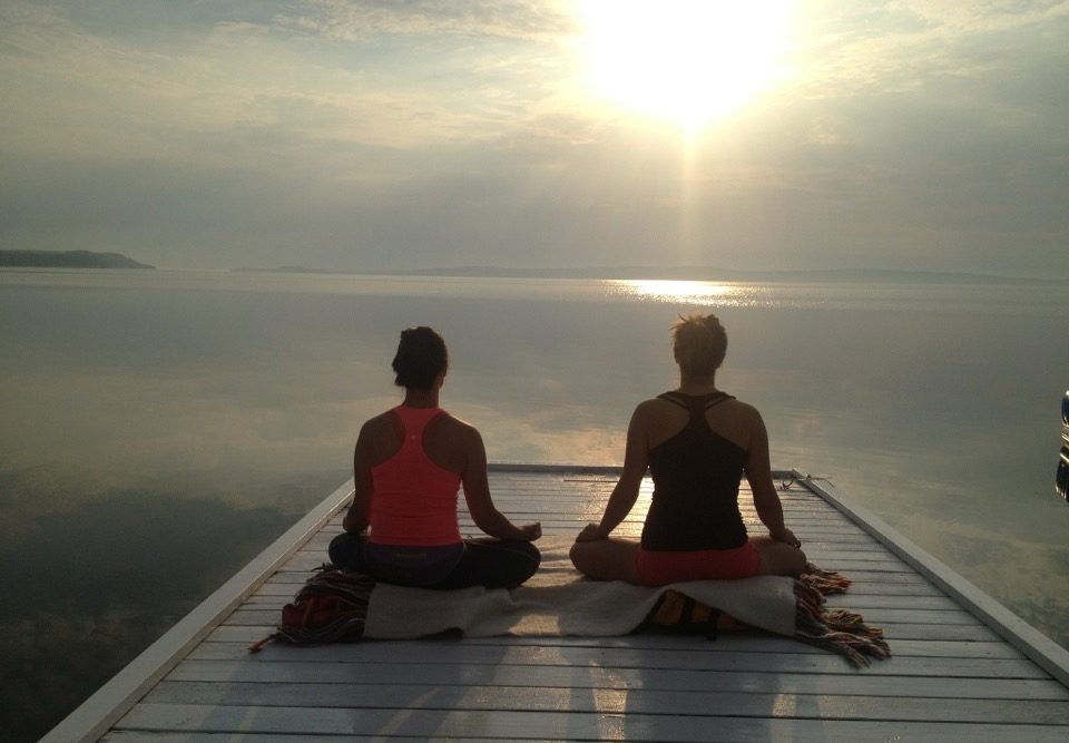 Morning meditation on dock at the Presidents' Suites and enjoying the sunrise on lake Temiskaming. / Méditation du matin sur le quai aux Suites des Présidents en profitant du levée de soleil sur le lac Témiskaming.